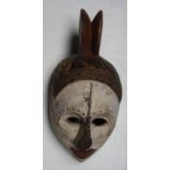 An African wooden Igbo tribal spirit mask, Nigeria, height 35cm width 17cm.