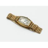 A gentleman's wristwatch with 9ct gold curved rectangular case the back inscribed "From Mary to Tom