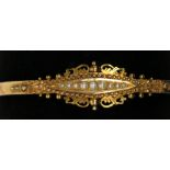 A 15ct gold late Victorian hinged bangle set with graduated pearls, 8.4g, hallmark Chester 1899.