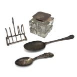 A George II silver tablespoon, one other silver spoon, a wire toast rack, 3.