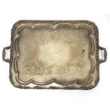 A large twin handled silver plated tray with twin cast handles and cast vine border,