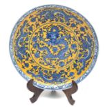 A Chinese blue and yellow dragon dish, Qianlong mark, 20th century,