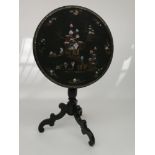 A Victorian black lacquered tripod table,