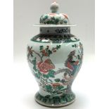 A Chinese famille vase and cover, 19th century, the body decorated with birds and flowering trees,