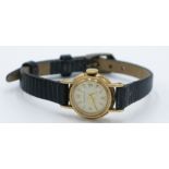A ladies Jaeger-LeCoultre 9ct gold cased wristwatch, the back numbered 8302, diameter 19.4mm.
