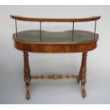 A Victorian walnut kidney shaped ladies writing desk,