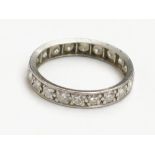 A platinum diamond set eternity ring. Condition report: Ring size approx. N.