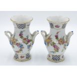 A pair of Paris porcelain vases in Sevres style, early 20th century, each with twin handles,