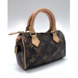 A Louis Vuitton limited edition Mini Speedy monogram handbag, cow hide leather handles,