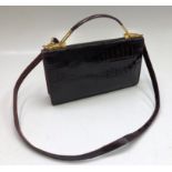 A crocodile skin handbag, 16 x 28.5cm.