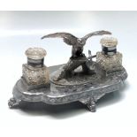 A silver plated twin bottle inkstand, surmounted by an eagle, width 29cm.