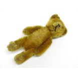 A teddy bear perfume bottle case with bottle, length 12.