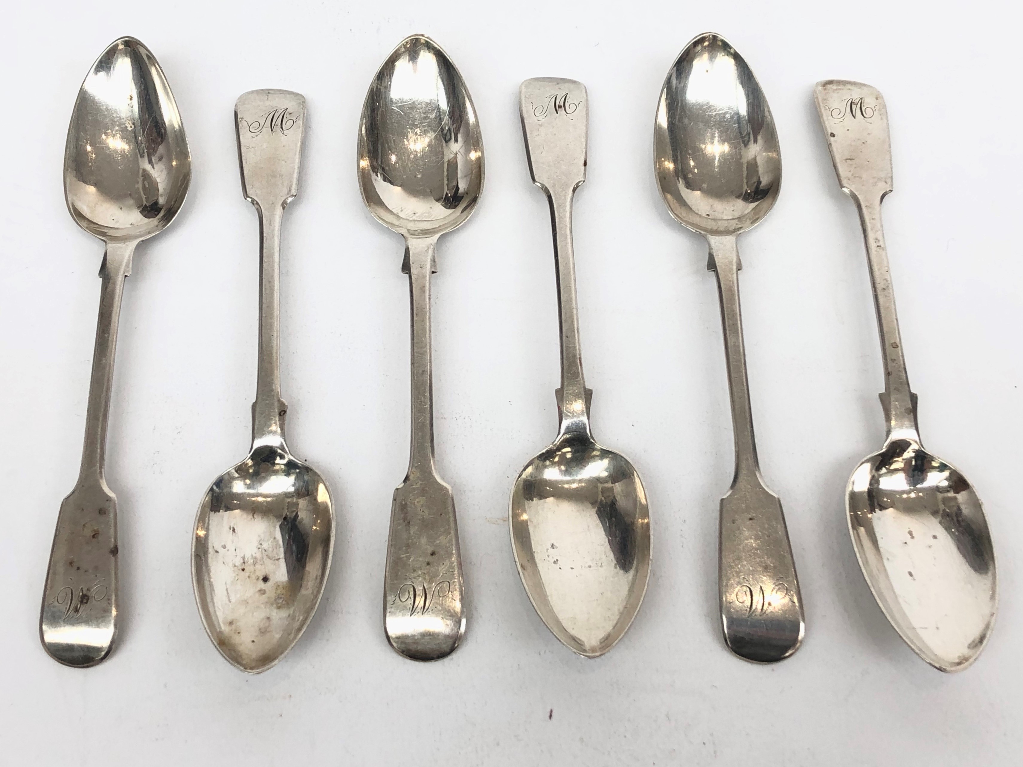 A set of six silver fiddle pattern teaspoons each engraved with a script M, by Robert Wallis,