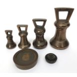 Four bronze bell weights, a 1 LB Worshipful company of Founders commemorative weight and 2 others.
