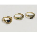 Three 14ct gold stone set rings, two have diamonds.