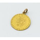 A George III spade guinea 1790, good very fine but lightly soldered with a suspension ring, 9g.