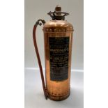 A 'Waterloo' riveted copper fire extinguisher, dated 1962, height 58cm.