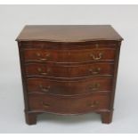 A George III style mahogany serpentine chest of drawers,