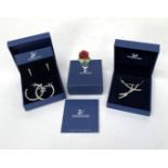 Swarovski a pair of earrings boxed, a pendant boxed, an ornament,