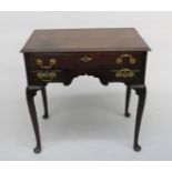 A George III oak lowboy, with three drawers on cabriole legs on pad feet, height 70cm, width 70cm.