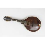 'The Gibson' mandolin, with inscribed oval paper label, full length 66.5cm, length of back 36.5cm.