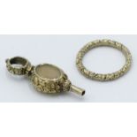 A Victorian high purity gold watch key, a Victorian chased gold split ring together with a ring box.