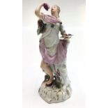 An unusual Meissen porcelain figure of a classical lady eating grapes, mid 18th century,