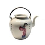 A Chinese famille rose porcelain teapot, early 20th century, with twin metal swing handle,