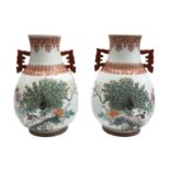 A pair of Chinese porcelain twin handled vases, Republic period,