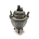 A Japanese bronze hexagonal koro and cover, decorated in archaic style, with Shishi and pup finial,