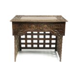 A Chinese hardwood side table, circa 1900,, carved with dragons and characters,