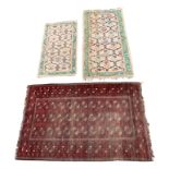 An Afghan rug, 200 x 126cm, and two Indian rugs, 183 x 94cm and 146 x 79cm.
