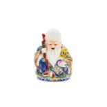 A Chinese famille rose porcelain figure of Shou Lao the God of Longevity, early 20th century,