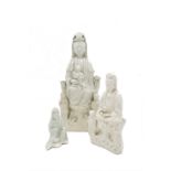 Three Chinese blanc de chine figures of Guanyin, heights 35cm, 23cm and 12.5cm.