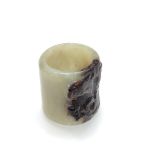 Chinese jade nephrite archers ring, carved with a stylised dragon, height 2.7cm, diameter 2.4cm.