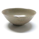 A Chinese celadon bowl, Ming Period, height 7.5cm, diameter 18.5cm.