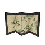 A Japanese painted folding screen, early 20th century, decorated with a rocky outcrop,