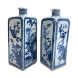 A near pair of Chinese blue and white porcelain flasks, Kangxi period,