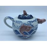 A Japanese porcelain teapot by Makuzu Kozan, Meiji period, of oval form,