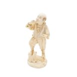A Japanese ivory figure of a hunter, Meiji period, with rifle in hand, signed, height 18.5cm.