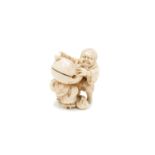 A Japanese ivory netsuke of a devil beating a drum, Meiji period, height 4.5cm.