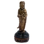 A Chinese soapstone figure of Guanyin holding a child, late 18th/early 19th century,