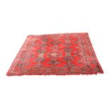 An Ushak 'Turkey Red' carpet, the madder field with rows of polychrome linked medallions,