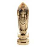A Japanese carved ivory figure of Kannon, late Meiji period,