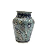 A Jerusalem pottery vase, the baluster body with stylised birds and flowers, height 20cm.