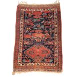 An Afshar rug, South West Persia, the iundigo field with a lozenge medallion, birds,