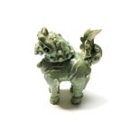 A Chinese celadon pottery incense burner in the form of a fo dog, with detachable head, height 29cm,
