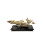 A Japanese carved ivory group of a tiger and stag, circa 1900-1920, height 7cm, length 17cm.