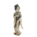 A Japanese carved ivory okimono of a standing geisha, 19th century,