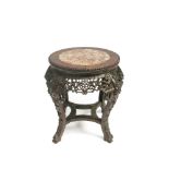 A Chinese carved hardwood jardiniere stand,